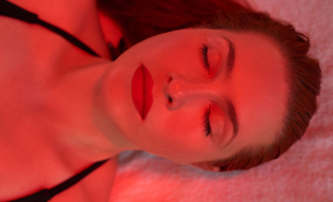 woman basking in red light