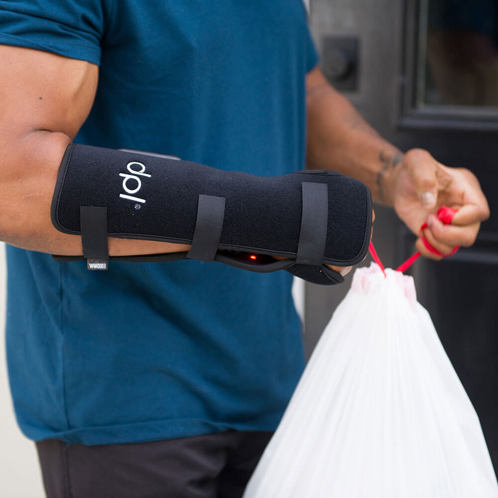 Man Doing House Chores With Wrist Wrap On