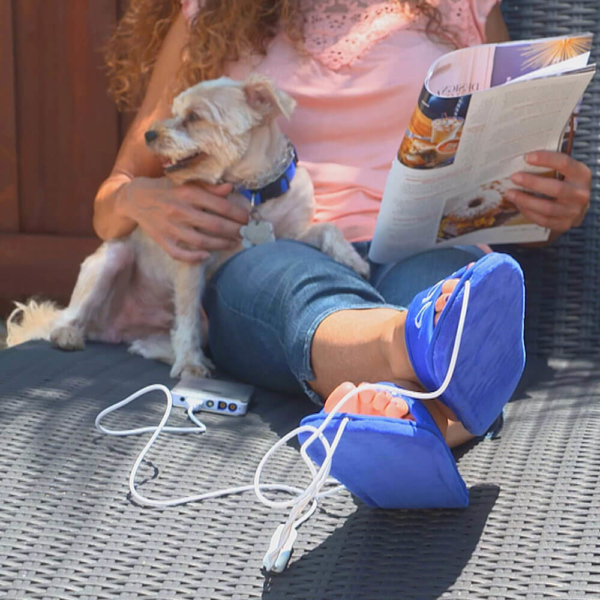 Woman Holding Dog While Wearing dpl Slippers