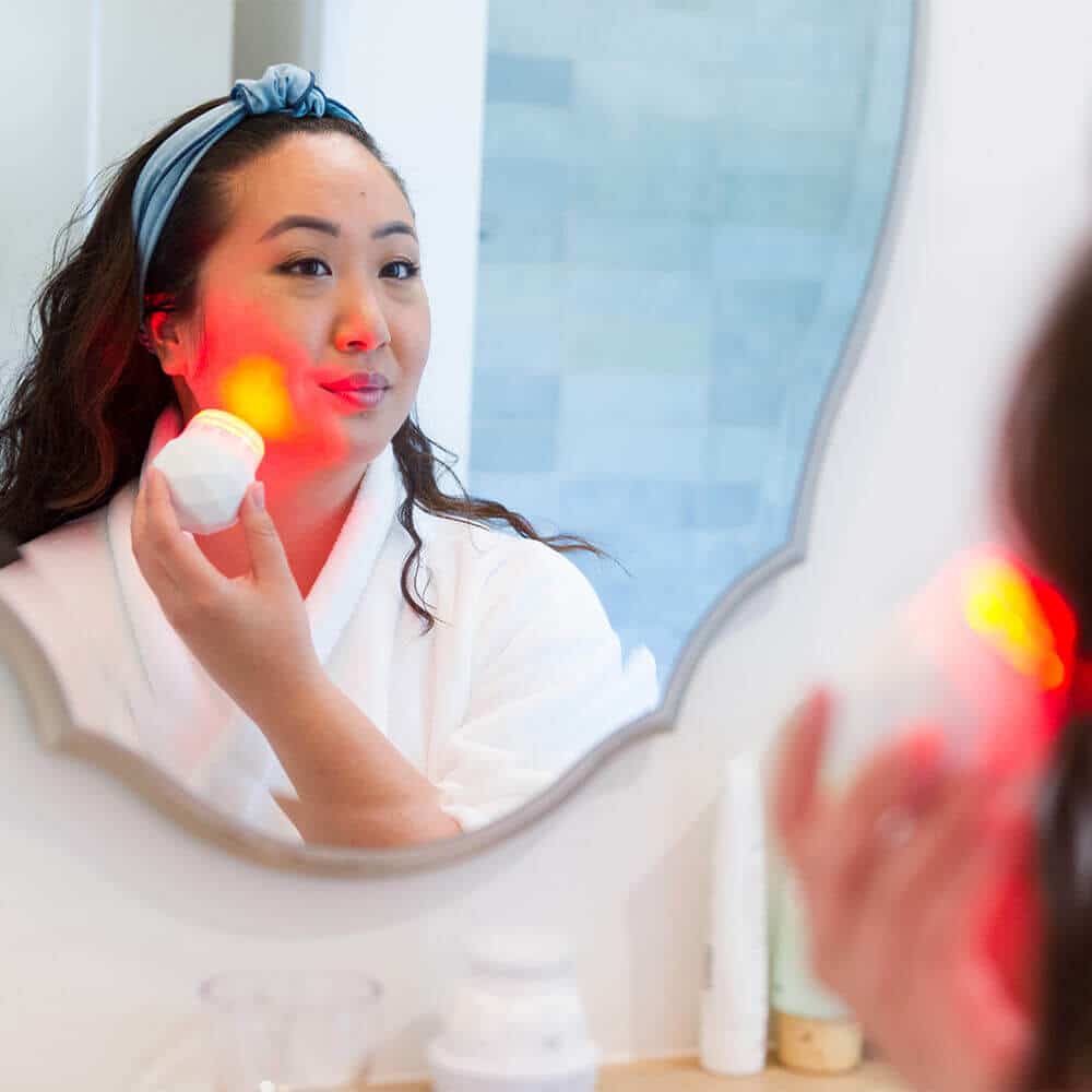 Applying Sonique Mini LED Sonic Cleanser