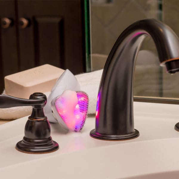 Sonique LED Sonic Cleanser Behind Sink