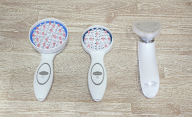 3 handheld reive Light Therapy devices on table