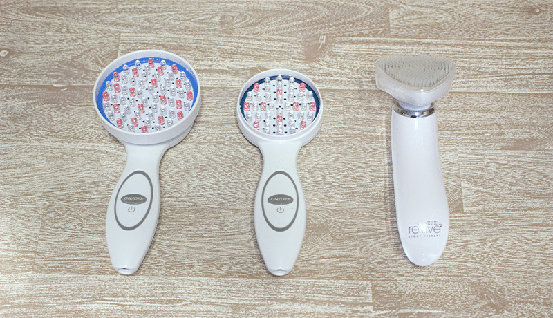 3 handheld reive Light Therapy devices on table