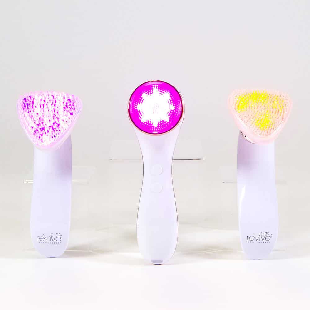 Group of Sonique Sonic Cleansing devices with lights on