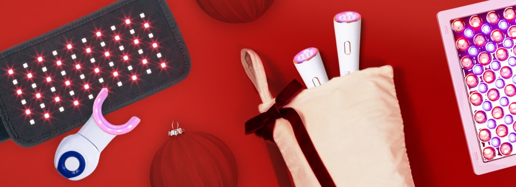 A hero image of reVive Light Therapy and dpl light therapy products on a red background with holiday accessories scattered around.
