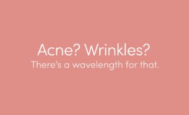 "Acne? Wrinkles? There's a wavelength for that." in white text on a rose-gold colored background