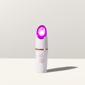 Lux Collection Spot Treatment for Acne, standing upright with LED lights on in front of white background