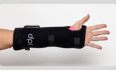 person using the dpl Wrist Wrap on their left hand.