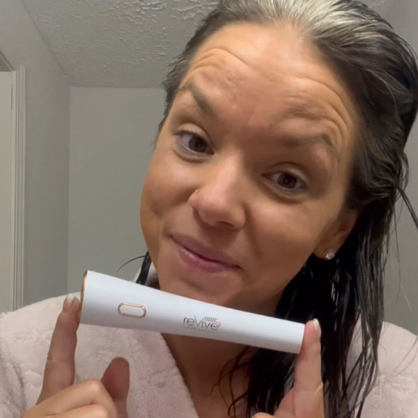 video of woman unboxing and showing how to use the Lux Collection Glo device